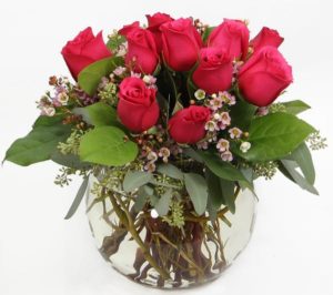 hot pink roses in a round vase