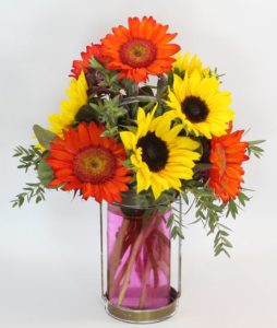 Yellow and orange sunflowers in vase