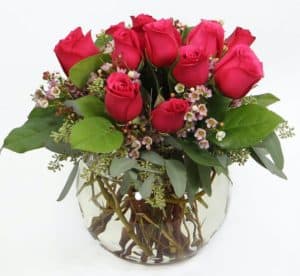 One dozen roses with a modern twist. Perfect for a candlelight dinner with someone special